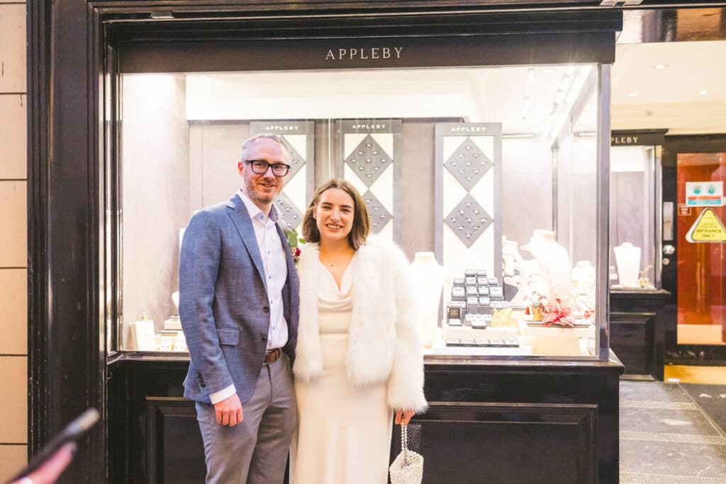 Couple in front of Applebey jewellers Dublin city engagement ring