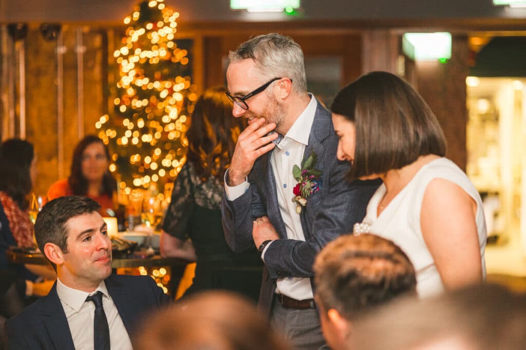 Couple interacting with guests at Christmas wedding Dublin city centre