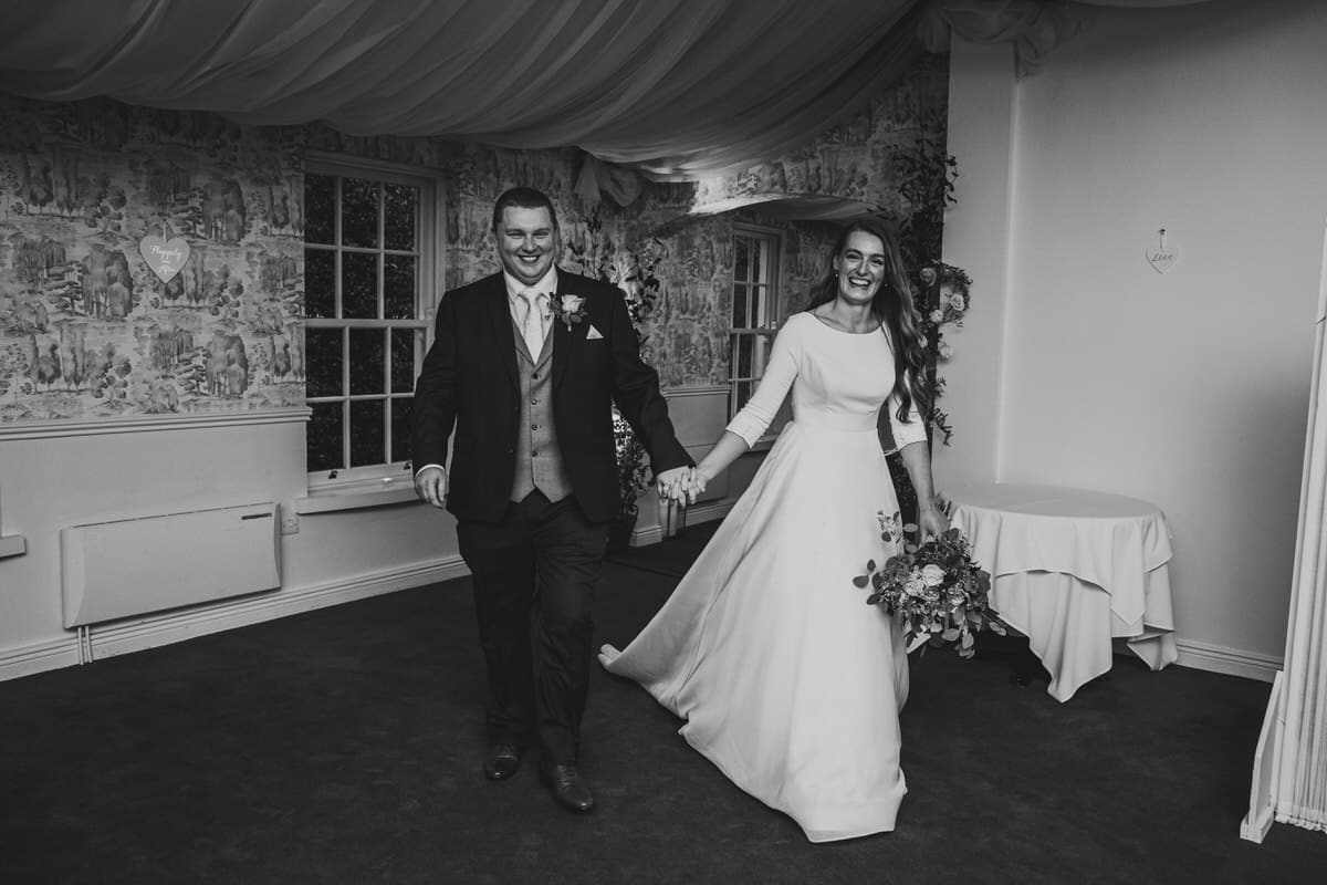 couple enter marquee at Rathsallagh House Wicklow Wedding