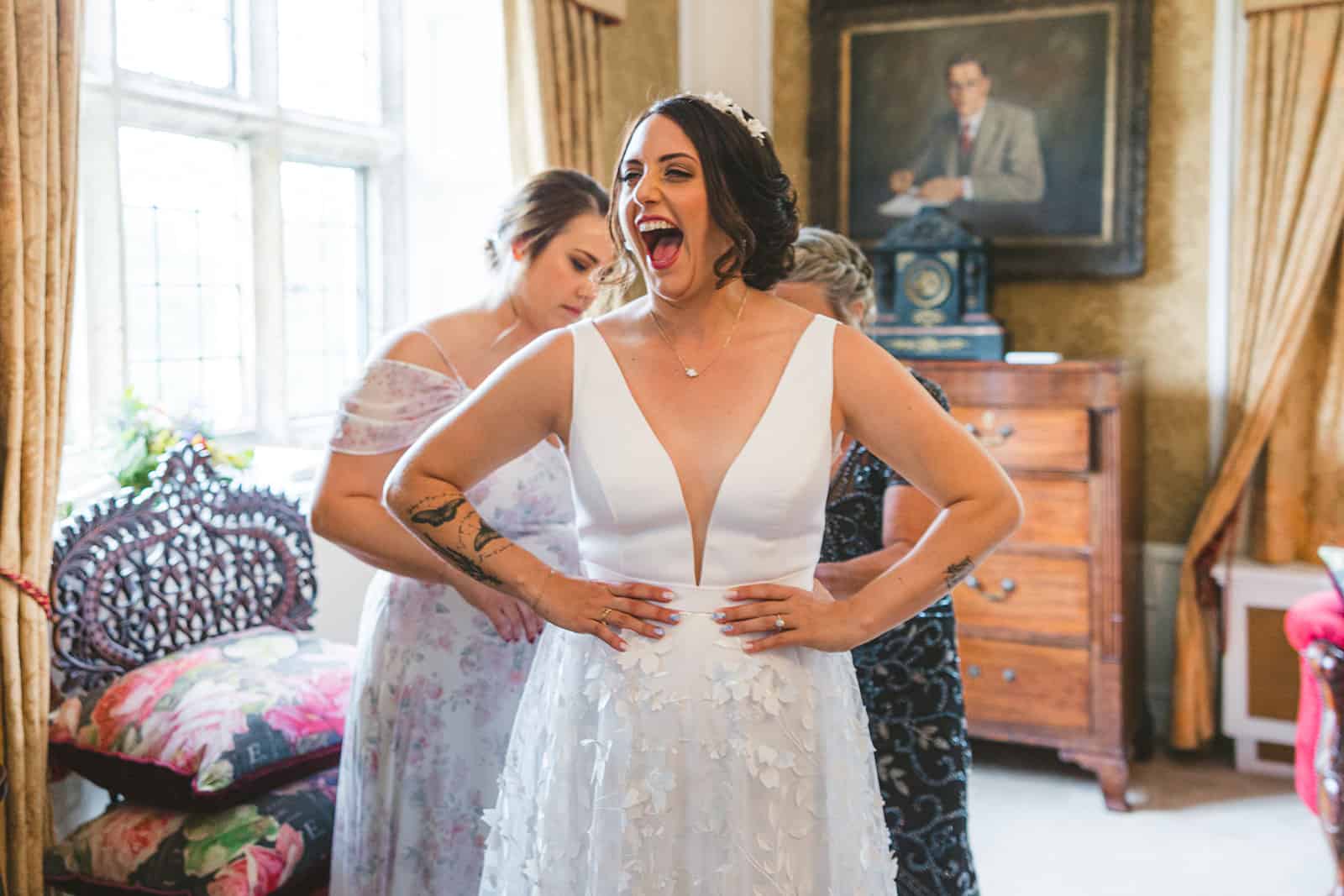 Laughing happy bride in bridal suite at Waterford Castle